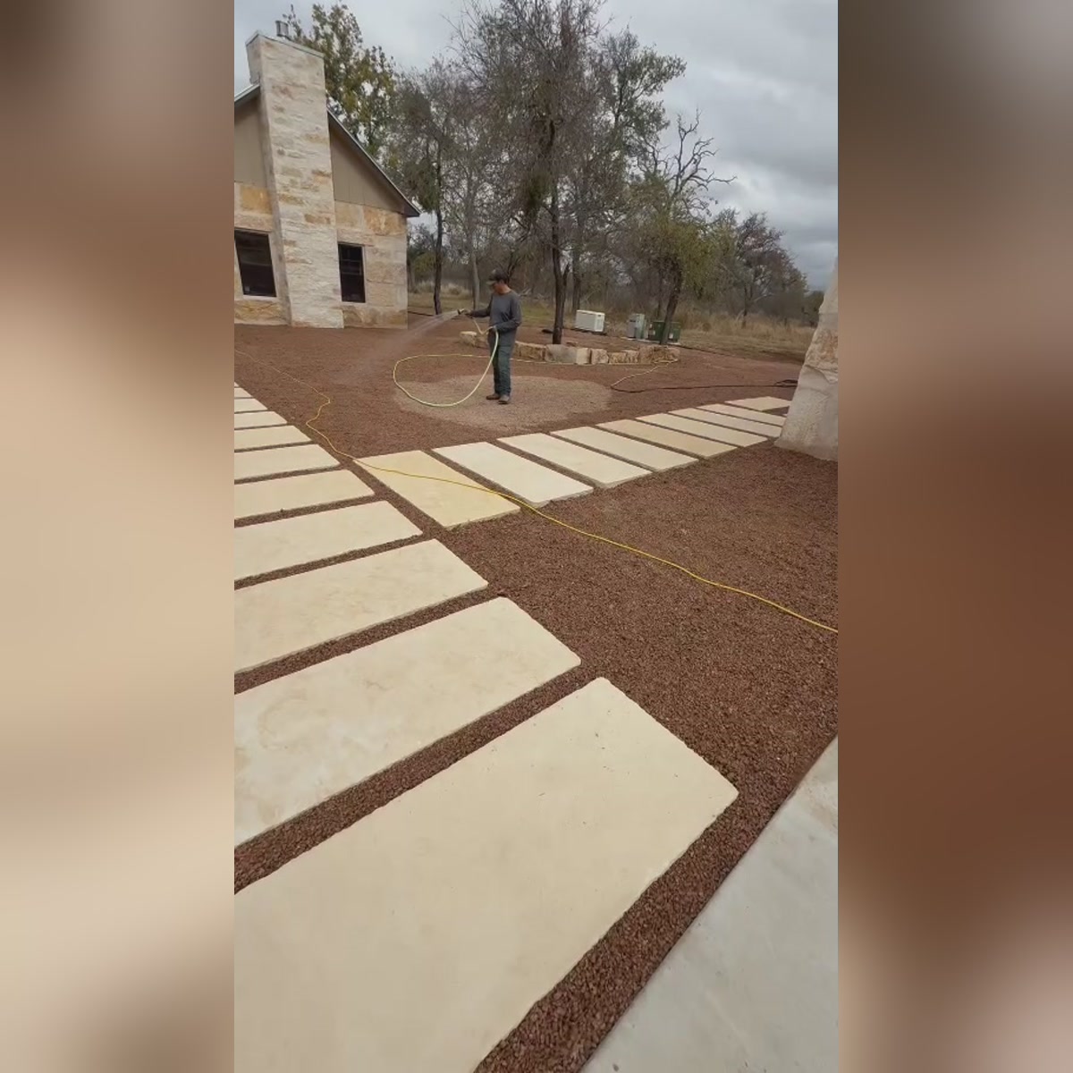 Full-scale hardscape walkway installation across the property
